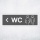 Schild "WC links grau hinterlegt"  –  Hochwertiges Hinweisschild im modernen Design für den Außenbereich 3 mm Alu-Verbund 30 x 10 cm